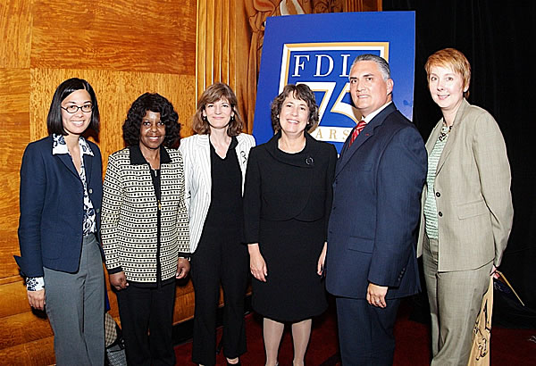 FDIC Chairman Bair poses with Citibank Community Relations Officer Victor   Ramirez and other audience members.