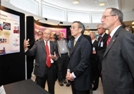 NEW MEXICO LABS VISIT: Energy Secretary Steven Chu (center) listens to a briefing at the Microsystems and Engineering Sciences Applications Microelectronics Laboratory at Sandia National Laboratories/New Mexico (SNL).