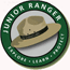 NPS Junior Ranger Logo: Learn, Explore, Protect. It sits on a cartoon of a NPS Park Ranger Stetson hat
