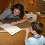 Ranger signing a Junior Ranger certificate