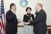 Secretary Abraham administers the oath of office to Ambassador Linton Brooks.