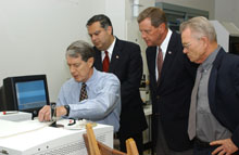 Ames Laboratory physicist John McClelland demonstrates the use of photoacoustic spectroscope