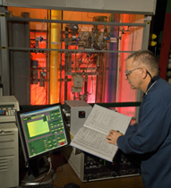 Scientist performing research on an electrolyzer at the Savannah River National Laboratory