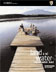 photo 2004 report cover people sitting on wood pier overlooking water and distant mountain