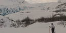 skier on Exit Glacier's outwash plain