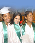 Three female students in graduation caps and gowns