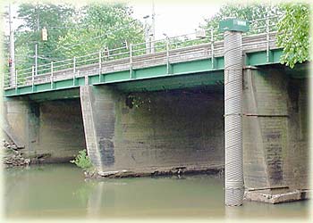 Picture showing one type of USGS gage house which houses a stilling well (a vertical pipe), and measurement and data-transmission instruments. 