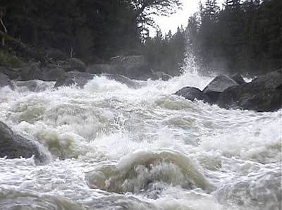 The high water of late spring rushes through the Lamar River Canyon