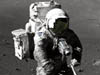 Harrison Schmitt, Apollo 17 lunar module pilot, using an adjustable sampling scoop to retrieve lunar samples