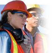 Man and women at construction site, signifying regulated industries