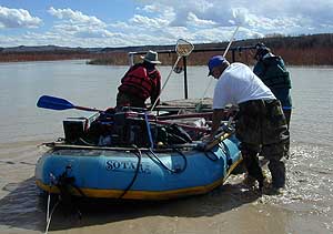 One of our inflatable rafts shoving off into the Rio Grande River, New Mexico, for an electrofishing survey. These boats are rated for white water conditions. 