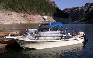 The 23-ft Parker cabin cruiser on Bighorn Lake, Montana, outfitted with multiple vertical gill nets for a fish survey