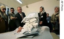 Iraqi election officials start the vote count at a polling station in Baghdad, Thursday Dec. 15, 2005 