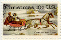 Vintage U.S. ten cent Christmas season postage stamp shows dappled horses pulling a couple in a 19th century sleigh through the snow