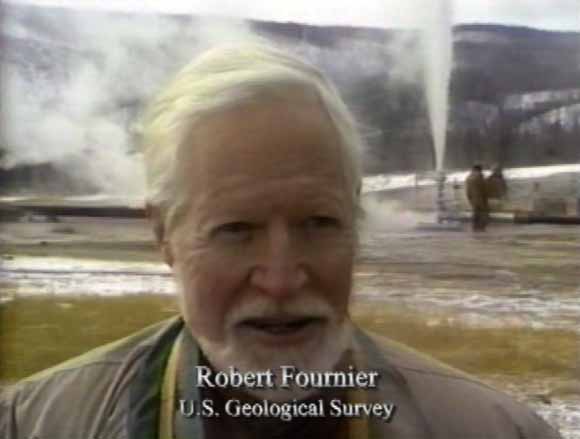 Photo of Bob telling story while steam spouts in the background