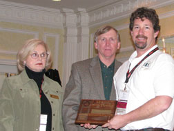 Photograph:  Erick Walker, District Range (right) poses with Peggy Vallery (left; NWTF) and Jere Peak (center).