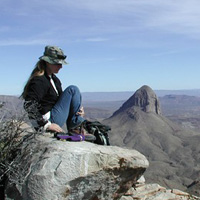 A hiker contemplates the desert