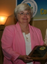 Sue Walker from Sandwich, Massachusetts is presented the Citizen Excellence in Community Involvement Award