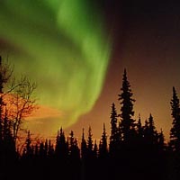 aurora and city-lit clouds, image credit Jan Curtis