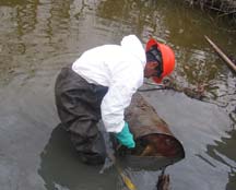 EPA collecting a hazardous waste container damaged from the hurricanes.