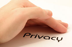 image of a hand shielding the word privacy