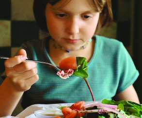 kid eating salad