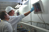 Ray Boswell (NETL) and Tim Collett (USGS) look for thermal anomalies found in sediments that would indicate the presence of gas hydrate during the 2006 Indian NGHP Expedition 01.