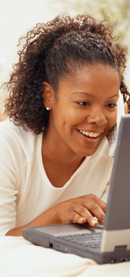 Click to open page with information for Information on Internships. Photo of a teenager at her computer