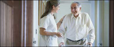 Photo: An elderly man with a healthcare professional
