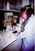 Chemist working with inorganic sample .
