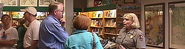 A park ranger talks to visitors at the French Quarter Visitor Center bookstore.