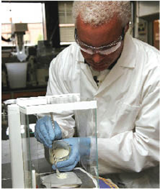 LaRC-SI is applied to another material in a laboratory.