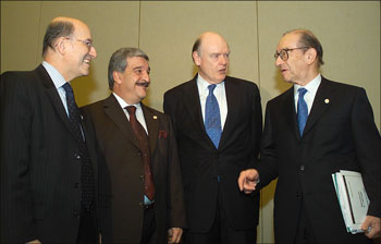 (Left to Right) Sinan Al-Shabibi, Governor, Central Bank of Iraq, Kamel Al-Gailani Minister of Finance, Secretary John Snow and Chairman Alan Greenspan.