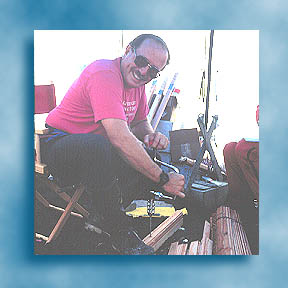 Geologist preparing wooden stakes for measuring coastal erosion
