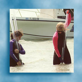 Marine scientists using push cores to collect sediment samples, see <a href="http://sflwww.er.usgs.gov/">South Florida Ecosystem</a>
