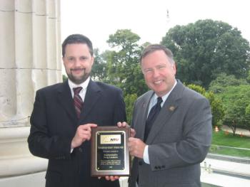 Andrew Moylan (left), vice president of the National Taxpayers Union, a nonpartisan citizen group, honors Congressman Doug Lamborn (right) with the “Taxpayers’ Friend Award.” 