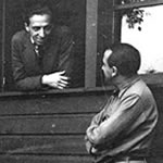 Aaron Copland and Clarence Adler sitting outside
