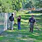 Fort Bragg personnel inspect riprap and fencing installed as part of the first phase of surface water remediation at solid waste management units.