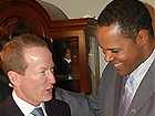 Photo of Barry Larkin exchanging gifts with Ambassador Brownfield