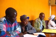 USADF Grantee Buseko Timber; Members looking over grant during signing ceremony 