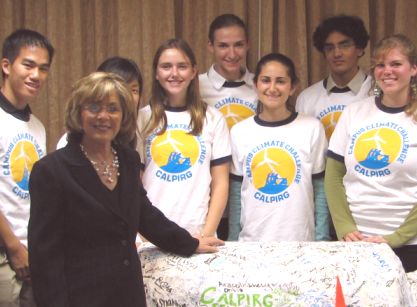 Senator Boxer accepting CALPIRGS paper Mache Polar Bear as a gift for fighting Global Warming