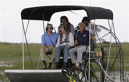 Interior Secretary Ken Salazar, front center, Sen. Bill Nelson, D-Fla., left, and Florida Gov. Charlie Crist, right, tour the Florida Everglades in an airboat Thursday, May 28, 2009. 
