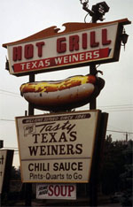 Sign reading 'Hot Grill Texas Weiners; Tasty Texas Weiners; Chili Sauce Pints Quarts to Go