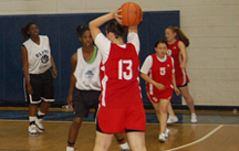Photo of Sports Visitor participants playing basketball against a local high school.