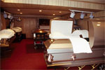 Several caskets in a large room