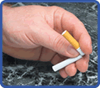 Woman's hands snapping a cigarette