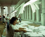 Women working with white fabric