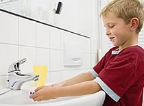 Photo of child washing hands
