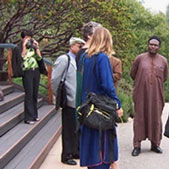 Photo of scholars from around the world sharing ideas after attending the seminar Religious Pluralism in the United States