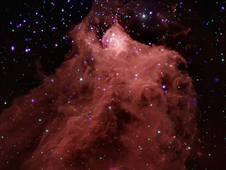 image combining data from NASA's Chandra X-ray Observatory and Spitzer Space Telescope shows the star-forming cloud Cepheus B